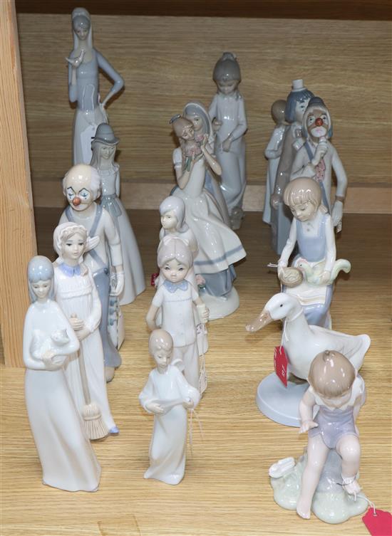 A collection of sixteen mixed Lladro style and Nao style figurines